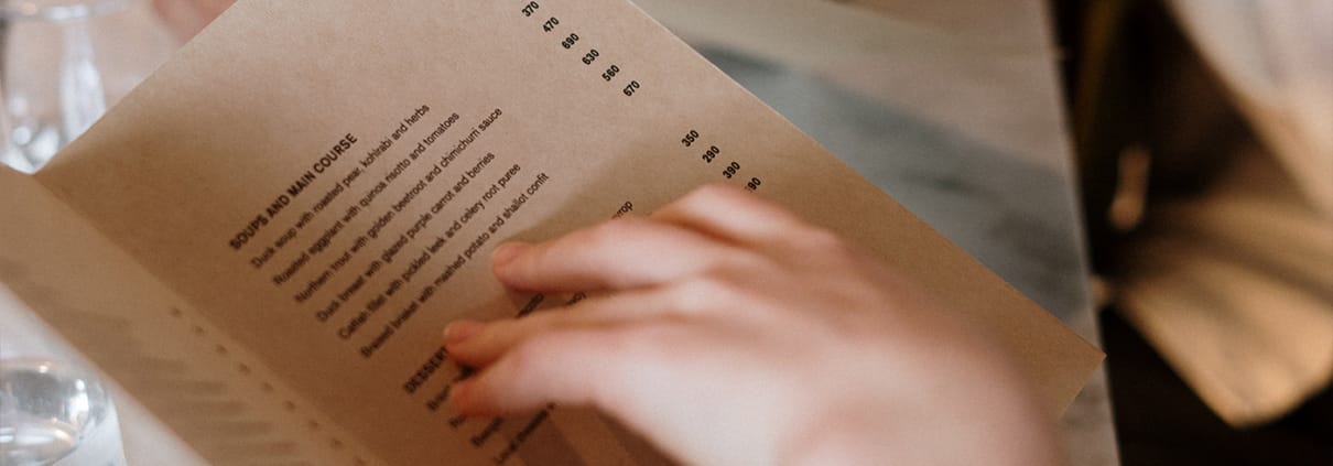 Why do restaurant franchises worldwide prefer a limited menu?