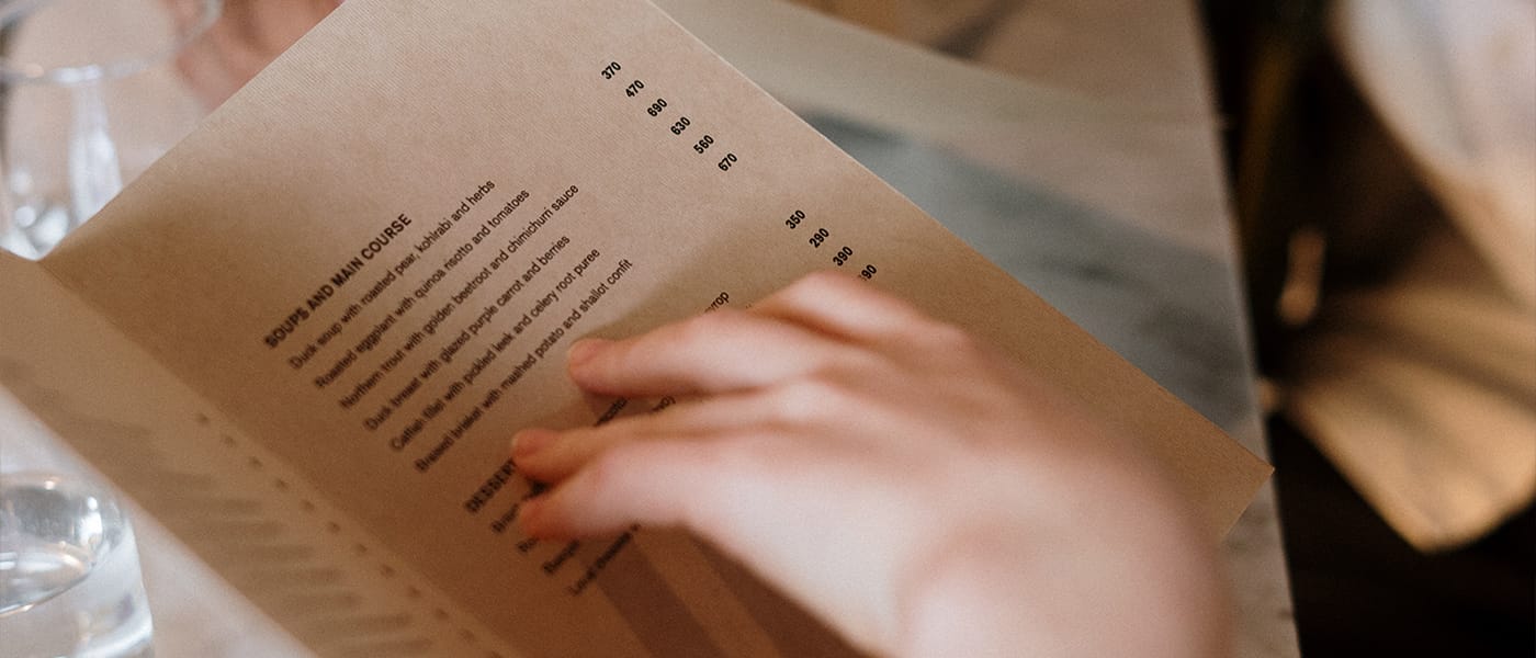 Why do restaurant franchises worldwide prefer a limited menu?